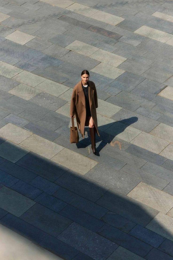 Overhead photograph of a lone figure and long shadow crossing a paved plaza, for the HSBC case study
