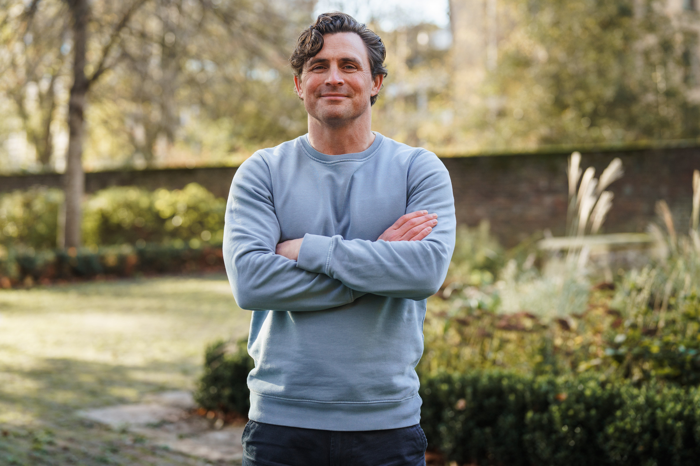 Portrait of Brendan Mahony, founder of Carb Load, in a garden